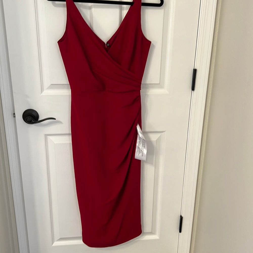 Beautiful never worn Deep Red dress. Runs small in the bust.